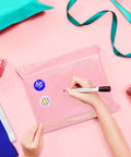 Person decorating 14.5 X 19 Inch Poly Mailers 50 Pack Self Seal Waterproof Shipping Bags For Clothing Durable Pink Packing Envelopes For Small Biz