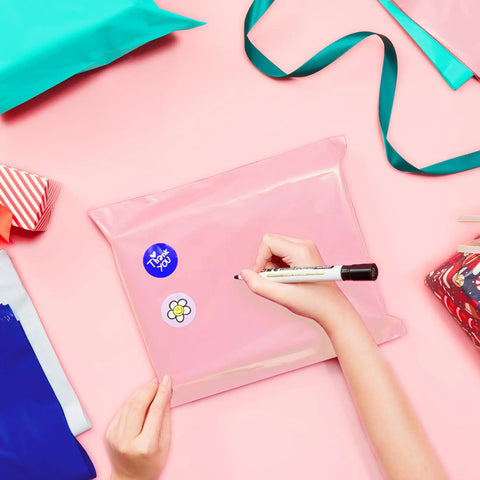 Person decorating 14.5 X 19 Inch Poly Mailers 50 Pack Self Seal Waterproof Shipping Bags For Clothing Durable Pink Packing Envelopes For Small Biz