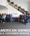 Team of people standing in an office with Tempo Communications sign, emphasizing American ownership and U.S. customer service.