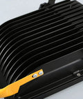 Spot Lighting 50W Led Rechargeable Construction Floodlight, 5000Lm Sup,， black aluminum housing with yellow handle.
