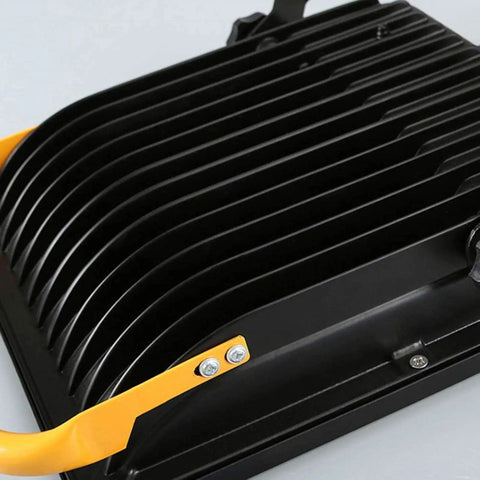 Spot Lighting 50W Led Rechargeable Construction Floodlight, 5000Lm Sup,， black aluminum housing with yellow handle.