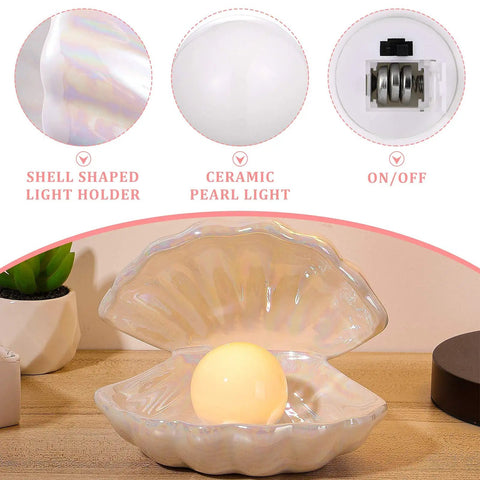 Ceramic Shell Pearl Light LED Clam Tabletop Lamp for Beach Room Decor with glowing white pearl on wooden surface
