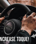 Classic Black Steering Knob Spinner Universal Fit Grip Handle Quick Turn Control for steering wheel with hands gripping.