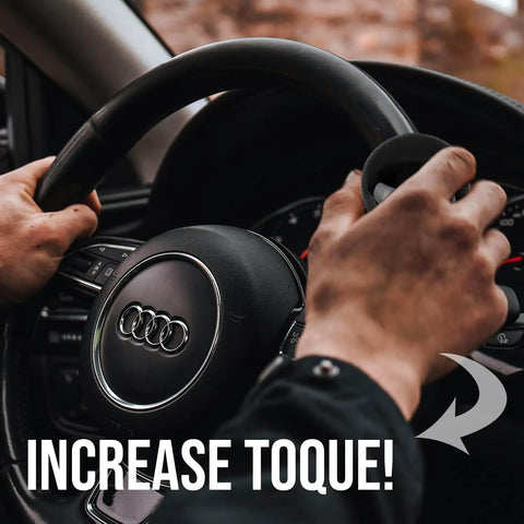 Classic Black Steering Knob Spinner Universal Fit Grip Handle Quick Turn Control for steering wheel with hands gripping.