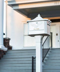 Front view of Hamilton Large Capacity Cast Aluminum Post Mount Mailbox Built To Last With Side Door Access in a residential setting