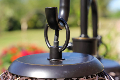 Detail of Castillo Outdoor Table Lamp in oil rubbed bronze with woven rattan shades, rustic two-light for Mediterranean style.