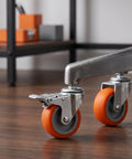 4pcs Inch TPR Swivel Caster Wheels with Brake, M8 Post close-up, orange rubber wheels on metal caster, heavy-duty design.