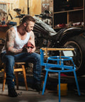 Man working with Heavy Duty Pro Grade Motorcycle Tire Changer Stand For 16 To 24 Inch Tires in garage