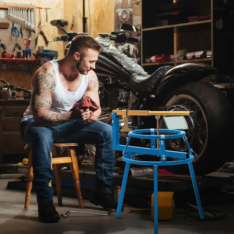 Man working with Heavy Duty Pro Grade Motorcycle Tire Changer Stand For 16 To 24 Inch Tires in garage