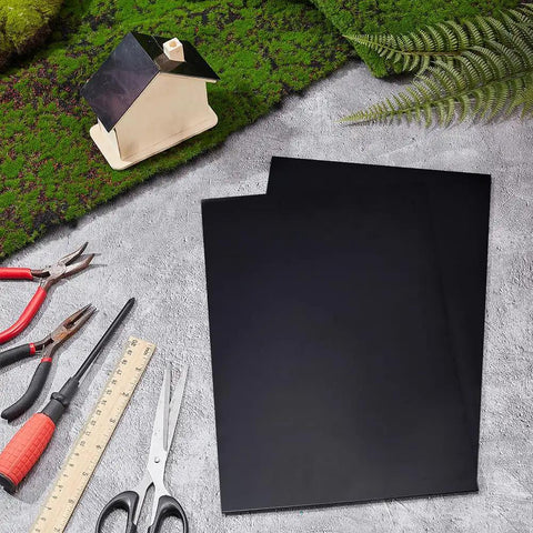 Two Black ABS Plastic Sheets 11.8 By 7.9 Inches 2mm Thick Hard Modeling Plastic For Architectural Models displayed with tools