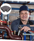 Plumber holding a wrench with a close-up of a 3/4 inch elbow iron pipe fitting. Elbow Iron Pipe Fitting Set, Six Pieces, Industrial Connectors.