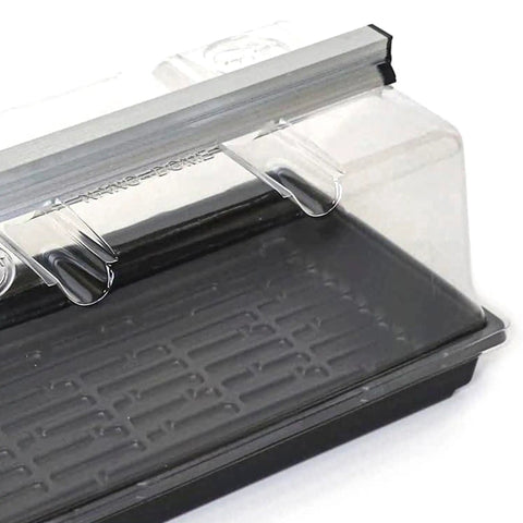 Prism Lens Powered LED Mini Greenhouse Kit with NanoTech Light Reflector and Double Thick Tray for seed starting and plant propagation, close-up of tray and dome.