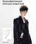 Model wearing black suit with Portable Handheld Turbo Fan With High Speed Air 22H Max Cooling Time, fan on a chrome lanyard.
