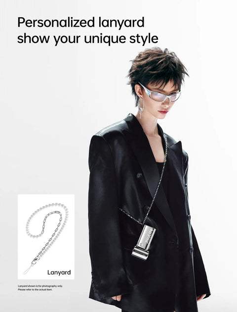Model wearing black suit with Portable Handheld Turbo Fan With High Speed Air 22H Max Cooling Time, fan on a chrome lanyard.