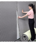 Real Deal Self Adhesive Acoustic Foam Panels For Legit Noise Blocking And Room Treatment being installed on a wall.