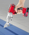 21V Cordless Electric Metal Shear With Swivel Head For Cutting Tin, Aluminum, And Steel Sheets held in hand over blue metal surface.