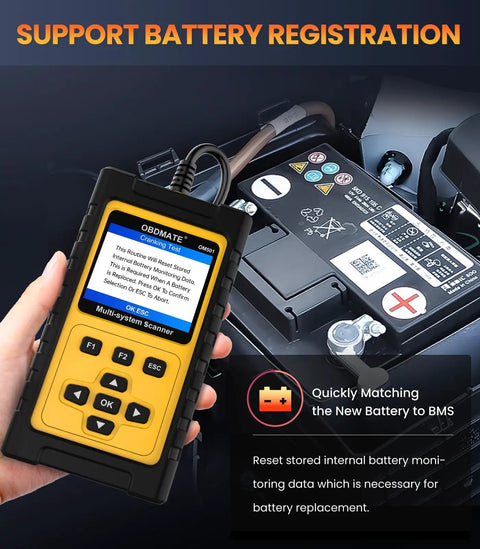 Person holding Jaguar Land Rover OBD2 Scanner OM501 Full System Diagnostic Tool with visible car battery