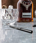Draw Enhancer Tool With Nubber Punch Cutter Accessories For Men And Women Fits All Sizes Portable Grab And Go Stainless Steel CNC Machined Non Corrosive 304 Grade High Precision Easy To Use And Carry on a table with glass and bottle
