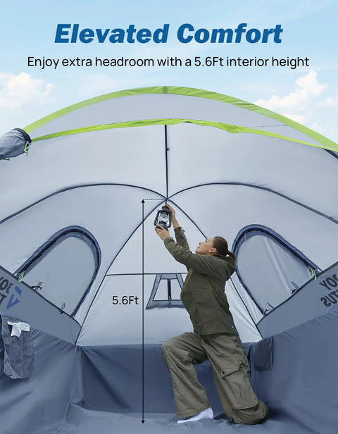 Interior view of Five Foot Pickup Truck Tent 2.0 showing 5.6ft height with user adjusting a lantern, green Oxford shell.