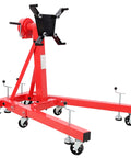 Heavy Duty Folding Engine Stand With 1500 Lb Rating And 360 Degree Geared Rotation Head includes smooth rolling casters in red.