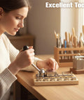 Person using Heavy Duty Ring Bending Kit For Jewelry Making With Chrome Steel Molds Wooden Base 0.47 To 0.87 Inch Sizes And 45/90 Degree Posts DIY Spoon Ring Shaper For Pros And Hobbyists To Fix Bent Rings on a wooden table.