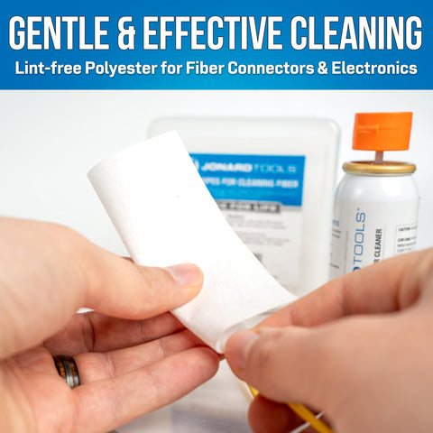 Hands using 90 Count Dry Wipes For Cleaning Bare Fiber, Connector End Faces, And Electronic Components, Lint Free Polyester Wipes In A Durable Mini Jar For Easy Debris Free Maintenance, with cleaning tools in the background.