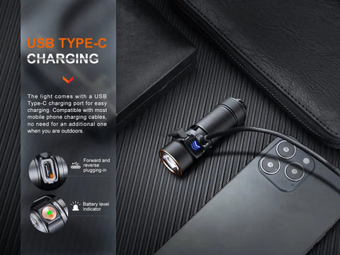 E18R V2.0 1200 Lumen EDC USB C Rechargeable Flashlight connected to USB-C cable near smartphone on table.