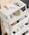 Top view of Five Drawer White Dresser With Wood Top And Steel Frame, Vertical Fabric Storage Tower, with phone and décor items on top