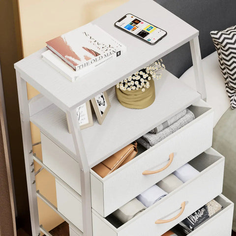 Top view of Five Drawer White Dresser With Wood Top And Steel Frame, Vertical Fabric Storage Tower, with phone and décor items on top