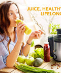 Woman enjoying juice from Heavy Duty Stainless Steel Juicer With Extra Wide Mouth For Smooth Extraction And No Pomace Or Pulp Leftovers.