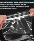 Hands stretching 100 Pcs POF Heat Shrink Wrap Bags 6x2 Inch Clear Heat Seal Pouches for durability and clarity demonstration.