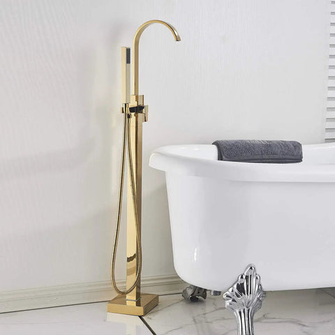 Solid Brass Freestanding Bathtub Faucet With Hand Shower in Gold Polished Finish next to a white clawfoot tub.