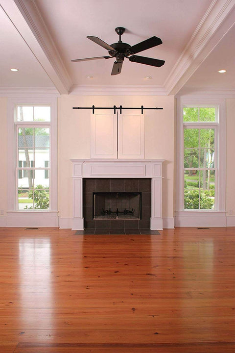 6 Ft Mini Cabinet Barn Door Hardware Kit Sliding Double Door DIY Friendly Finish In Oil Rubbed Bronze installed over fireplace