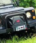 Soft Winch Cover With Elastic Bungee Cord Fasteners For 9 5Ti And XD9000i Winches on SUV bumper, black weatherproof.