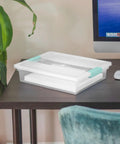 12 Pack Clip Box Stackable Clear Plastic Bins With Latching Lids for arts and crafts on a desk next to a computer