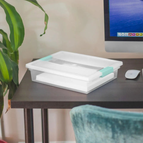 12 Pack Clip Box Stackable Clear Plastic Bins With Latching Lids for arts and crafts on a desk next to a computer