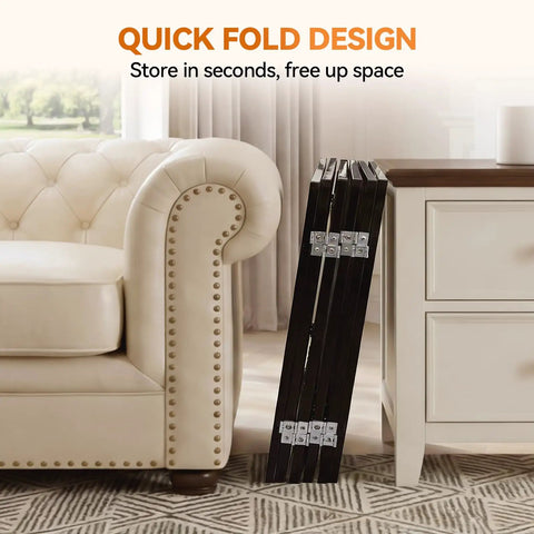 Extra Wide 60 Inch Free Standing Dog Gate For Home Doorways Rock Solid Metal Pet Fence folded against furniture.