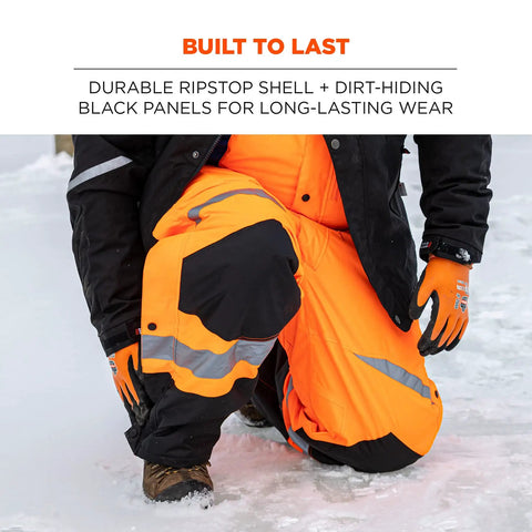 Person wearing high-visibility insulated bib overalls with thermal 160g fill weatherproof 300D shell orange X-large