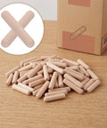 Fluted Wooden Dowel Pins Set Natural Hardwood Dowels One Quarter Inch By One And One Fifth Inch on wood surface with packaging