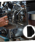 Barista using espresso machine with Compact Rubber Insulation Sleeve Heatproof For Steam Wand, close-up.