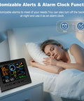 WiFi Weather Station With Rain Gauge And Moon Phase Indoor Outdoor Thermometer And Humidity Wind Speed And Direction Barometric Pressure Alarm Clock Real Time Home Weather Monitoring displayed beside a sleeping woman.