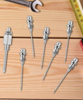 Grease Needle Gun Nozzle Kit With Six Nozzles And One Dispenser Hardened Steel Grease Injector Tool displayed on a wooden surface