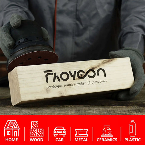 Person holding orbital sander with 5 Inch 8 Hole Orbital Sanding Discs Set, 100 Pcs Hook And Loop Sandpaper on wooden block