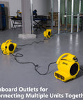 Professional 500 Max CFM Air Mover With 12 Ft Cord, 3 units connected in a construction site, showcasing onboard outlets