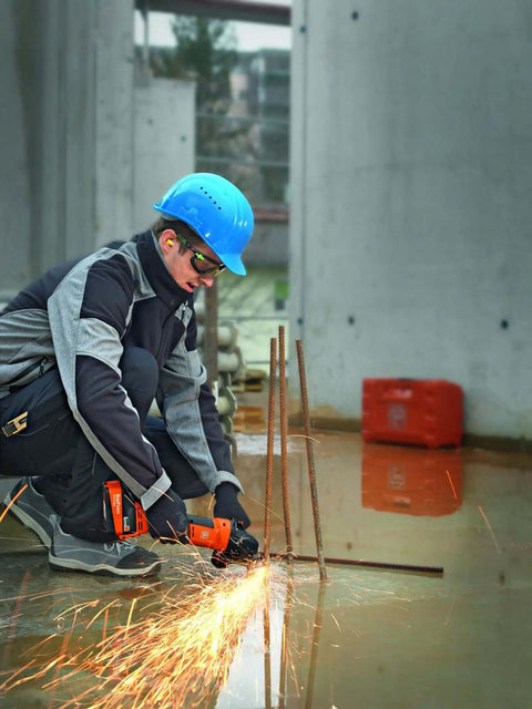 Pro Rig Cordless Angle Grinder With 125 Mm Disc And 18 Volt Brushless Motor Cranks Out 1100 Watts Of Torque in action cutting rebar with sparks.