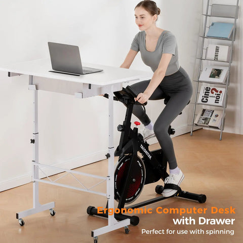 Woman using Compact Adjustable Standing Desk On Wheels For Home Office, Rolling Laptop Table with bike setup