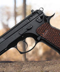 Side view of handgun with Palm Swell Grips For CZ 75 Full Size Orange Black G10 With Palm Texture Free Screws