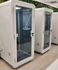 Portable One To Two Person Soundproof Office Pod With Thick Acoustic Panels and Whisper Quiet Ventilation, white exterior and glass door.