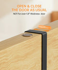 Over The Door Broom And Mop Holder in 304 stainless steel shown mounted on a door, accommodates up to 1.8-inch thickness.