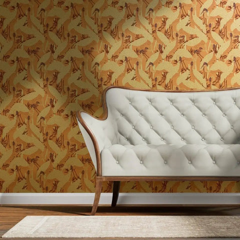 Peach Heron Spring Gold Metallic Wallpaper With Hella Glam Fibrous Texture For Top Shelf Indoor Vibes Professional Paste The Wall Eco Friendly Type I Wall Covering Made In Usa Class A Fire Rated Solid Build featuring a white tufted couch.